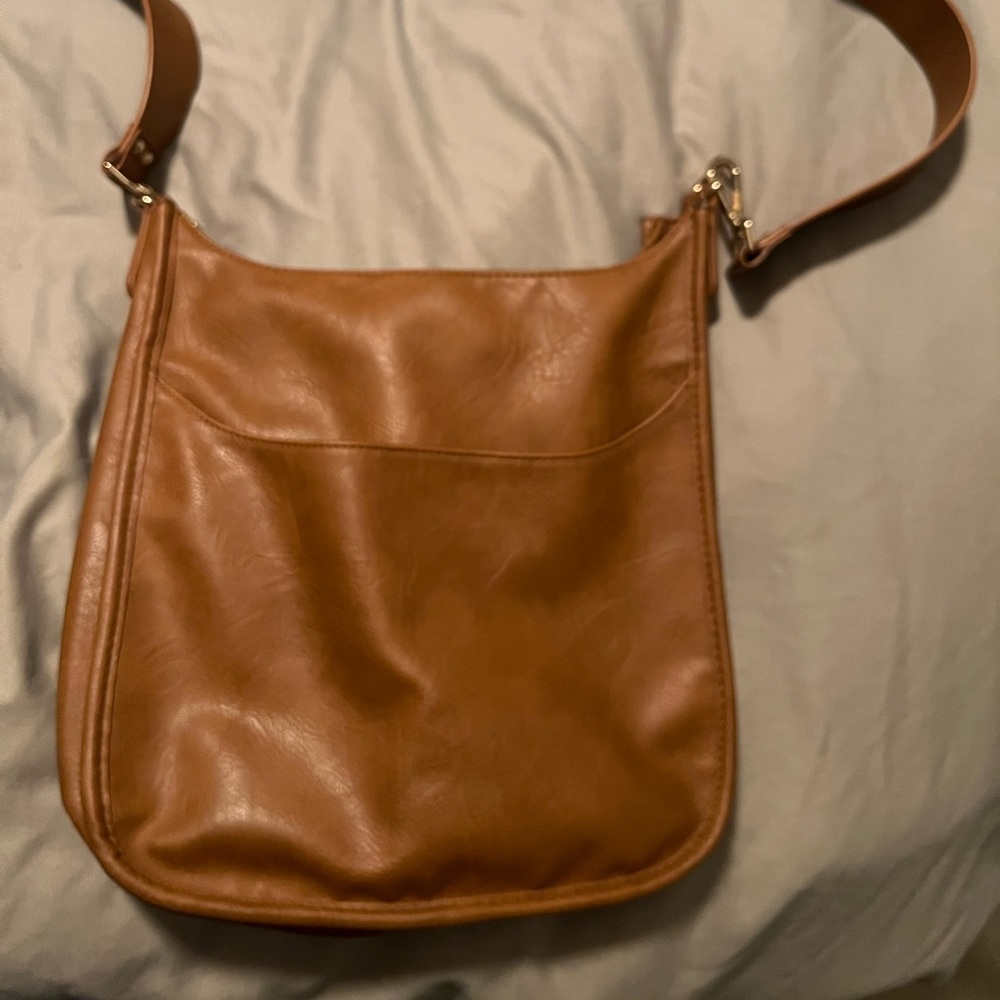 Like new, ‘Classic’  vegan leather Ah-Dorned messenger bag. Strap never used
